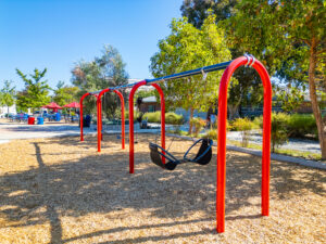 A view of the play structures with integrated shade providing cover.