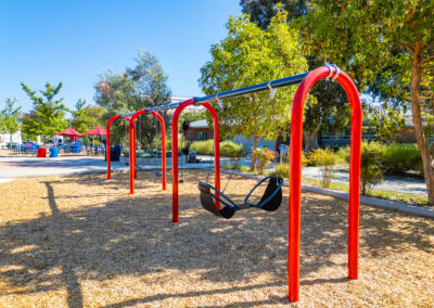 A view of the play structures with integrated shade providing cover.
