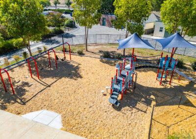Playground with integrated SkyWays® shade to keep the area cool.