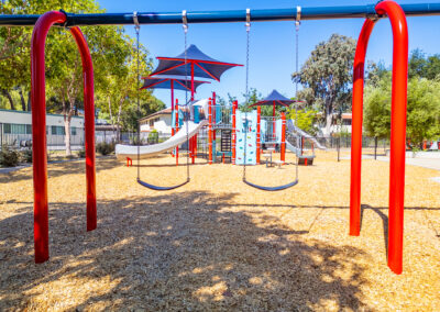 The colorful PlayBooster® system with multiple slides and climbing features.